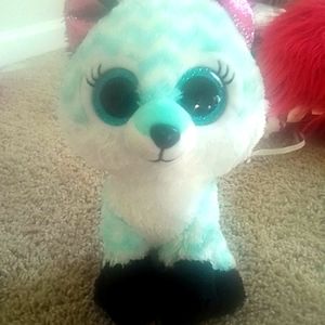 Blue,white,pink and black stuff animal fox